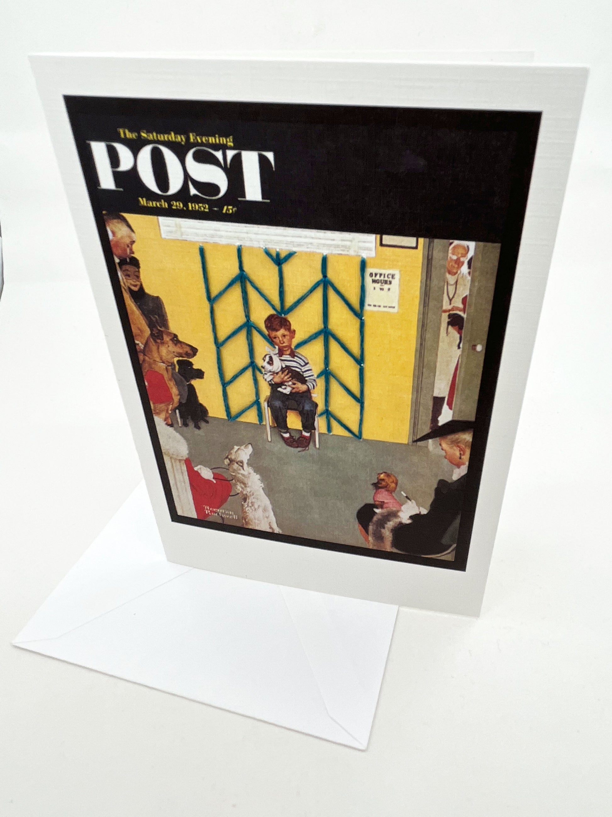 greeting card with a print of an issue of The Saturday Evening Post, a picture of a a boy holding his dog at the vet looking worried, with hand embroidered chevron pattern  on the wall behind him